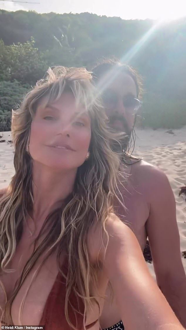 The model, 52, looked incredible in a plunging halterneck top as the German guitarist, 35, wrapped his arms around her waist