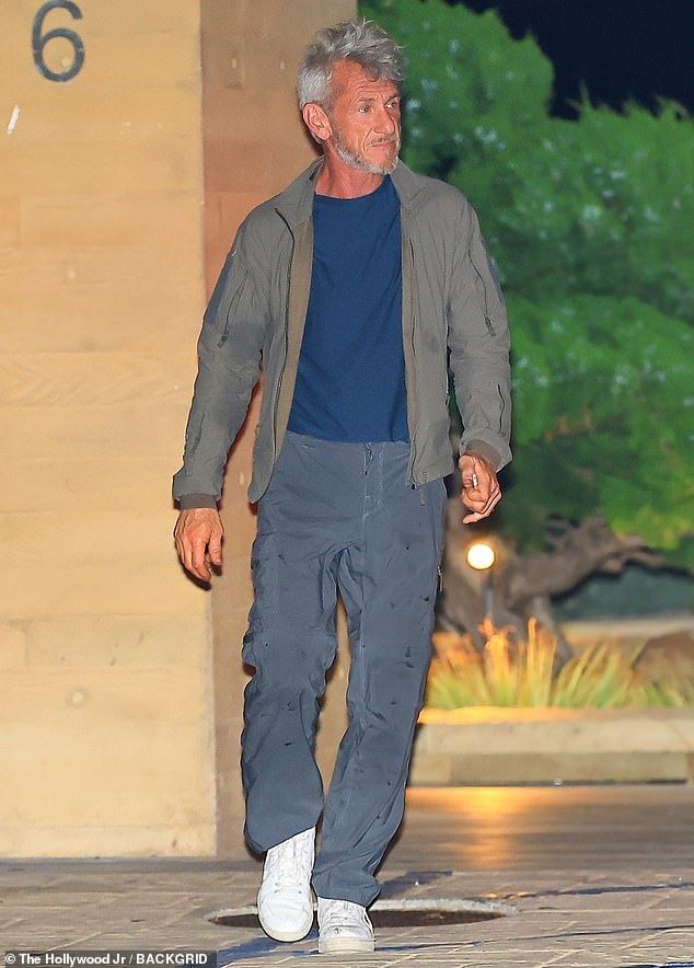 Also seen was Sean Penn, 64, who also sported gray hair as he wore an olive green shirt over a dark blue T-shirt with shiny charcoal gray cargo slacks