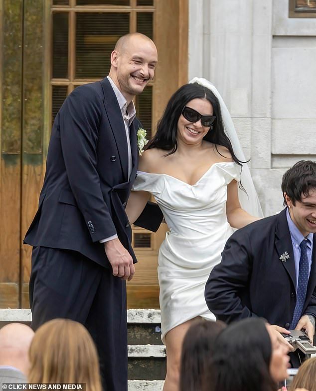 The Brat singer threw convention to the wind and opted for a leggy white mini dress which she teamed with her trademark sunglasses