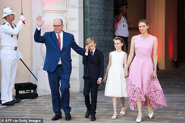 Albert, 67, and his wife Charlene, 47, were accompanied by their 10-year-old twins, Crown Prince Jacques and Princess Gabriella, as the royal family celebrated the joyous occasion at the Palace Square