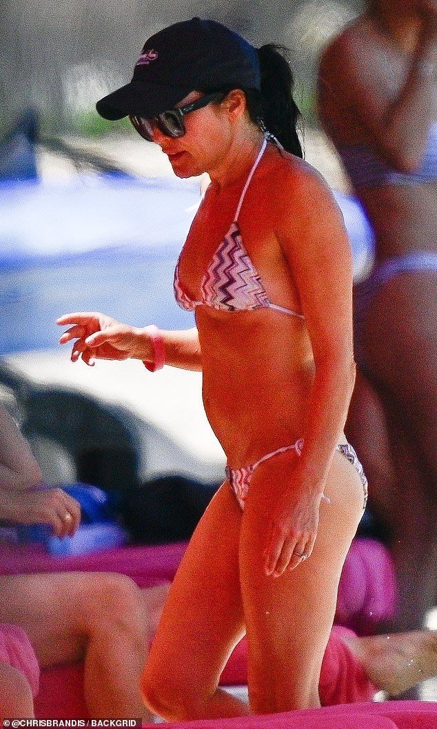 The iconic Irish singer slipped into a colourful patterned bikini which boasted a triangular top and drawstring bottoms