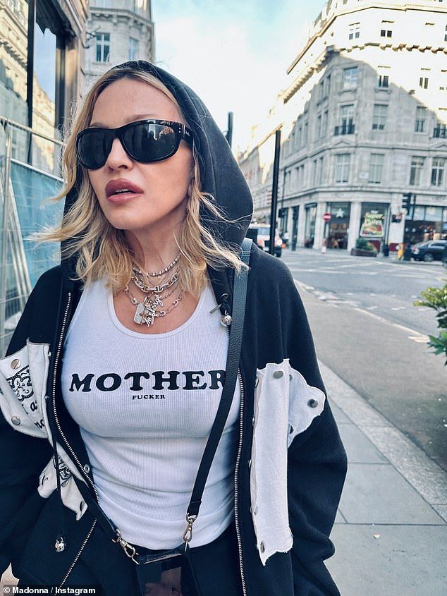 Madonna could also be seen wearing a t-shirt which said 'Mother' as she strolled around the Big Smoke