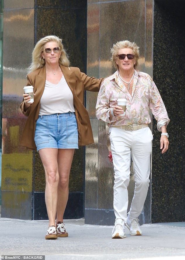 They both appeared in high spirits as Penny put her arm around her partner, with each of them holding a coffee in their hand