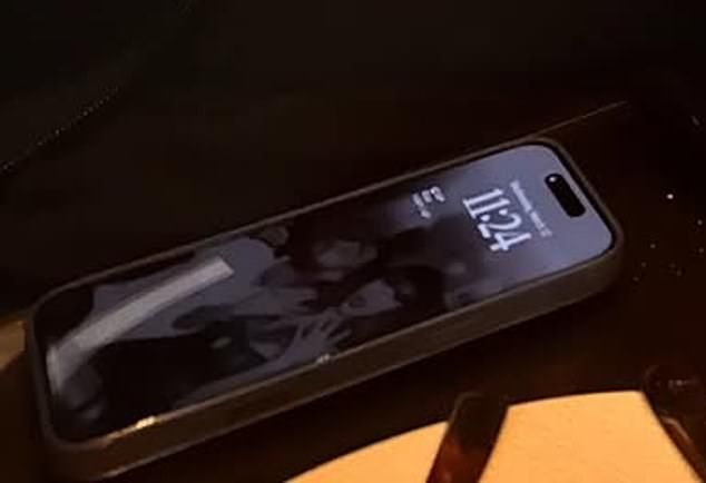 But Taylor is not wearing an engagement ring in the snap he has saved as his background