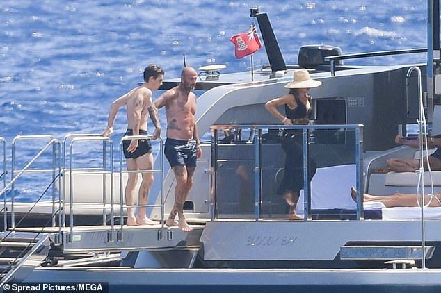 The trio looked in great spirits on the family trip