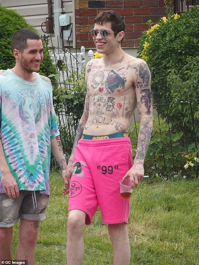Davidson admitted that a sizable tattoo on his chest that was inspired by a run-in with Dave Chappelle is his biggest source of tattoo-related regret; pictured in 2019 in nYC