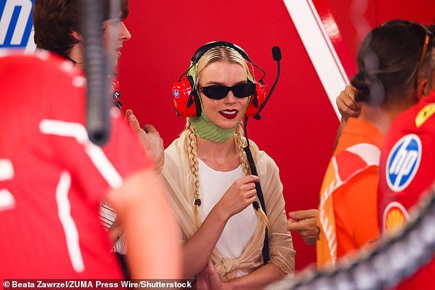 Anya and Malcolm looked every-inch the doting couple as they watched the highly-anticipated race from the pit