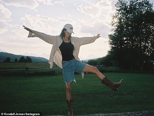 One image was taken as the model showed off her cowboy-inspired outfit which comprised of denim shorts and a black tank top