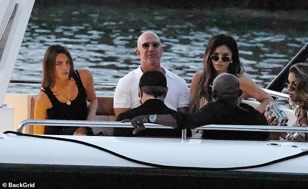 The gang looked serious in another shot as they headed to shore