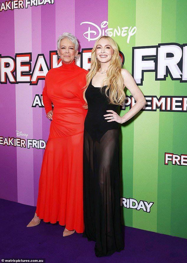 Jamie, 66, (left) was also looking much younger than her years as she posed beside Lindsay against the media wall