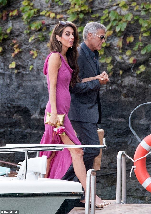 Amal Clooney, 47, put on yet another showstopping display as she and her husband George, 64, headed out for dinner with guests in Lake Como on Wednesday