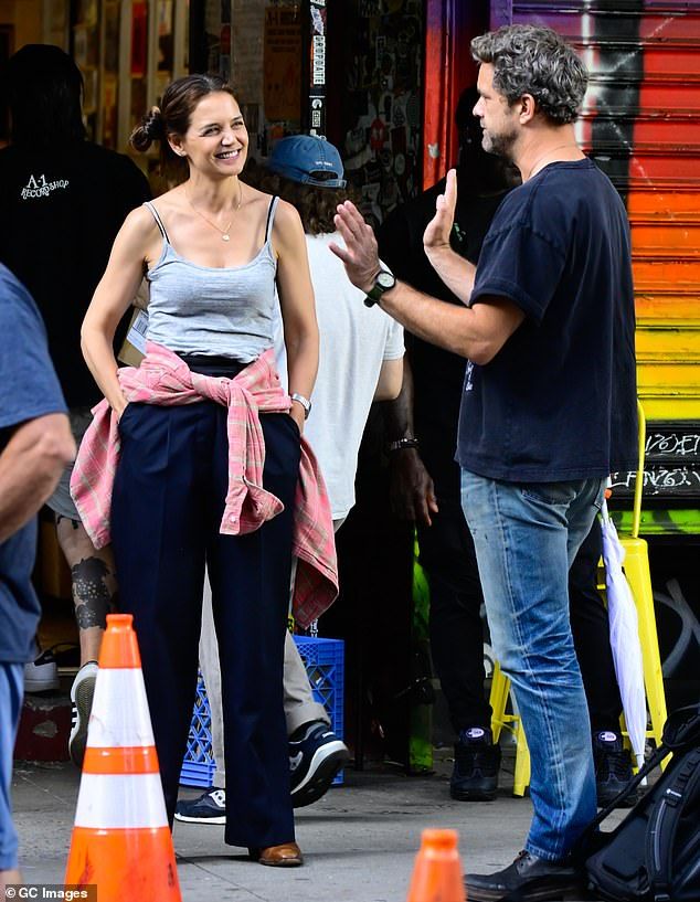 Katie Holmes was seen lighting up around her costar Joshua Jackson when shooting a scene for their new movie Happy Hour in New York City on Thursday