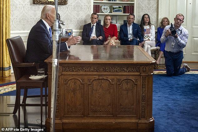 Former President Joe Biden (L) speaks during an address to the nation about his decision to not seek reelection as his son Hunter Biden (2nd L), Hunter's daughter Finnegan Biden (3rd L), Ashley Biden's husband Howard Krein, Biden's daughter Ashley Biden (