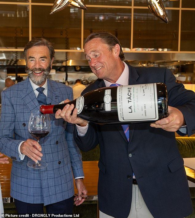 Restaurateur and hotelier Robert Walton is served a glass of 2006 La Tache red wine from a bottle costing 175,000