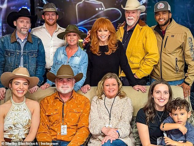 The late music manager could be seen in the top left alongside his brother Shelby with McEntire, Brandon's former stepmother, front and center of the family portrait