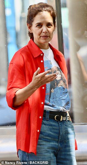 Katie opted for bright red button down and belted jeans for her day of filmmaking