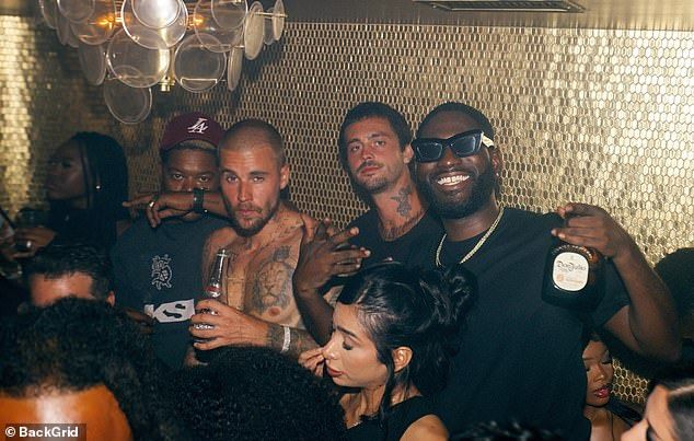 And while there were about five women mingling nearby, Bieber seemed far more focused on his bros at the boozy bash