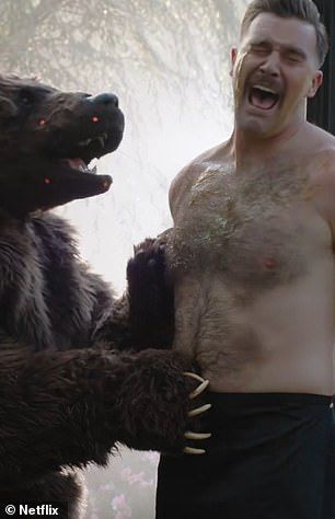 In the scene, Bad Bunny slathers honey on a shirtless Kelce, before a person in a bear suit brutally attacks him