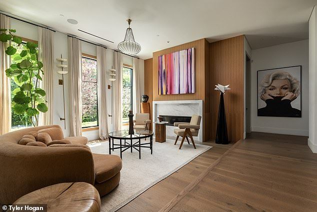 The property contains five bedrooms, a two-vehicle garage, and even a detached guest house