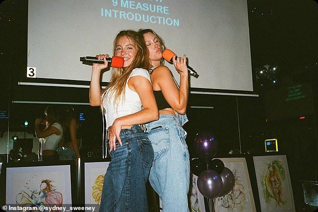 She was also seen with a microphone on a stage as she had her back to a pretty pal