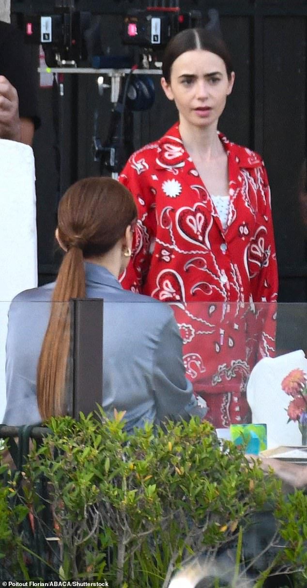 The actress transformed into her effortlessly chic character to shoot scenes alongside her co-star Ashley Park on the terrace of luxury hotel St Regis