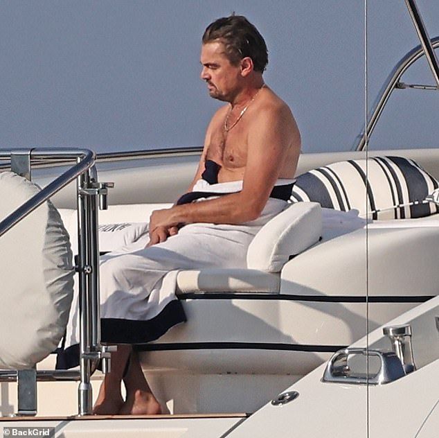 Leonardo DiCaprio looked unimpressed as he whiled away another day at sea with girlfriend Vittoria Ceretti in Ibiza recently