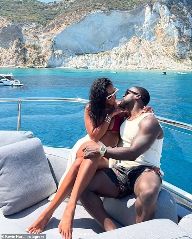 The couple cosied up on a sofa at the front of the boat as they shared a smooch in front of the picturesque ocean backdrop