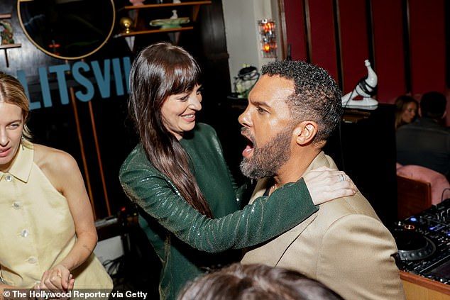 Elsewhere, lead star of the movie Dakota Johnson, 35, appeared in high spirits as she larked around with actor O-T Fagbenle, 44
