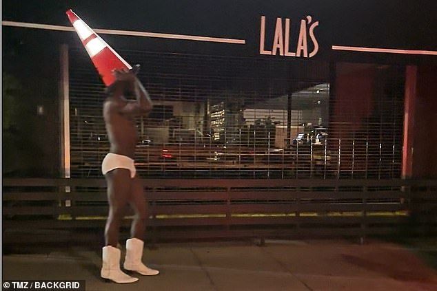 He even placed an orange traffic cone atop his head