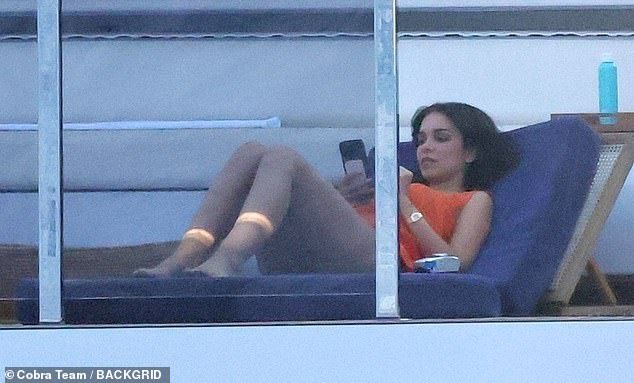 Jackie looked stunning in an orange swimsuit