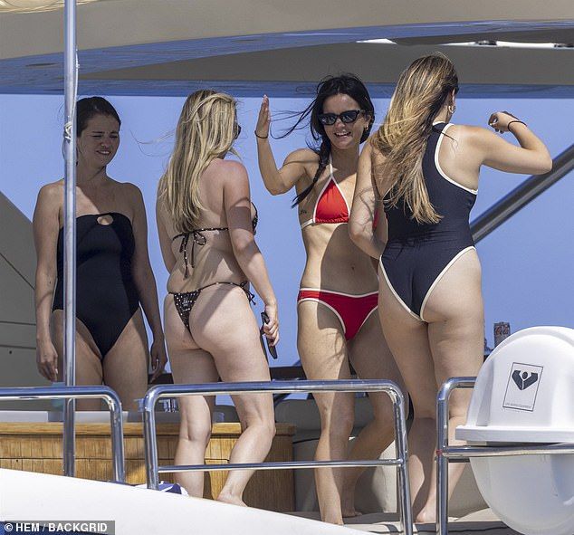 Her longtime pal Ashley Cook sizzled in a red bikini while her palRaquelle Stevens donned a dark two-piece