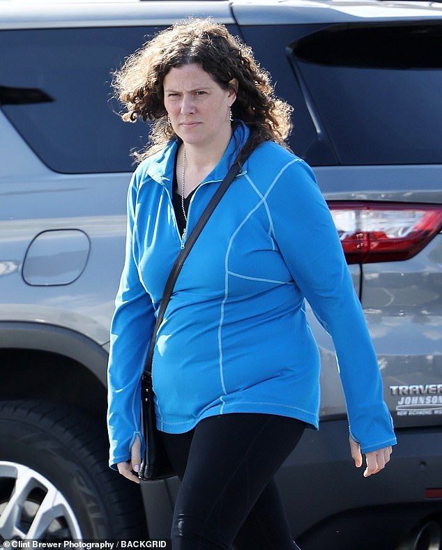 The Biggest Loser winner - who lost an impressive 155lbs 11 years ago - looked sporty with a royal blue workout jacket with black Capri leggings and sneakers