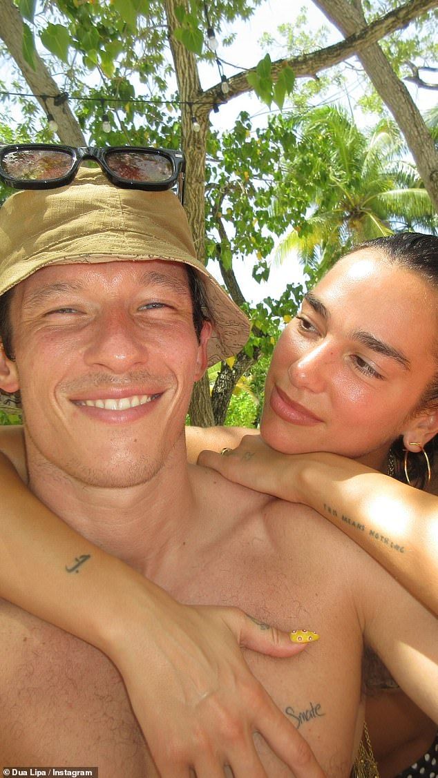 Dua Lipa shared a loved-up selfie with her fianc Callum Turner, before showing off her abs in a black bikini top as she continues to celebrate her 30th birthday