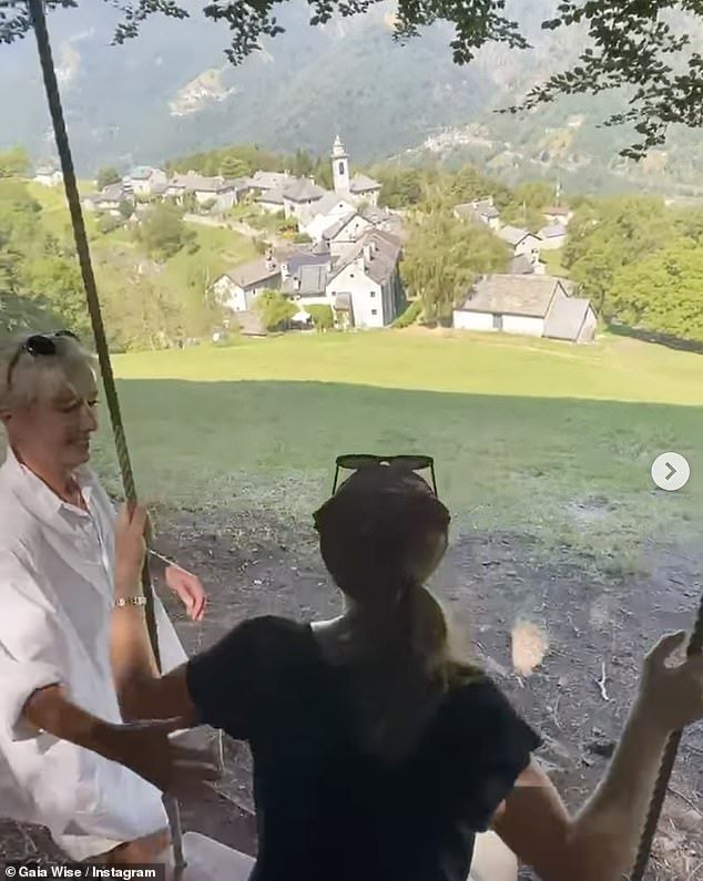 Gaia soaked in the scenery with Emma on a bench before enjoying a mountain top swing