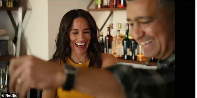 Meghan Markle was forced to laugh off a very awkward interaction during the newly-released second season of her show With Love, Meghan. (Pictured: Meghan with mixologistPayman Bahmani-Bailey)