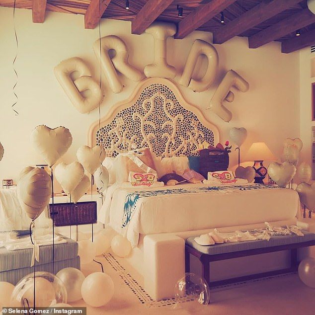 The bedroom she was staying in was decorated in white, with heart-shaped balloons and a sign that read 'bride'