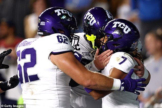 Jordan Dwyer #7 of the TCU Horned Frogs celebrates with his teammates after catching a touchdown pass during the first half of the game against the North Carolina Tar Heels