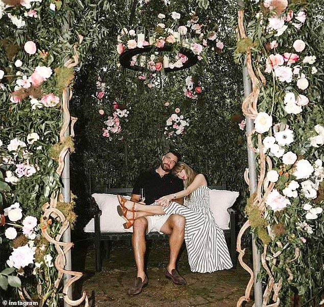 The loved-up couple pose for an photo in Kelce's garden immediately after their engagement