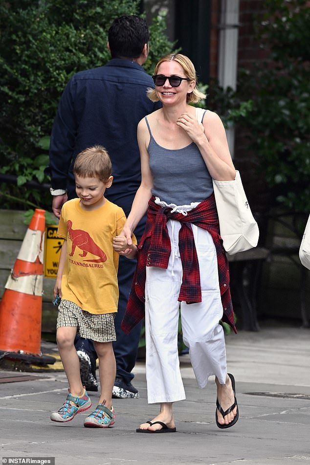 New mom of four Michelle Williams has been seen for the first time since expanding her family via surrogate, enjoying a day with her son Hart Kail in Brooklyn on Tuesday