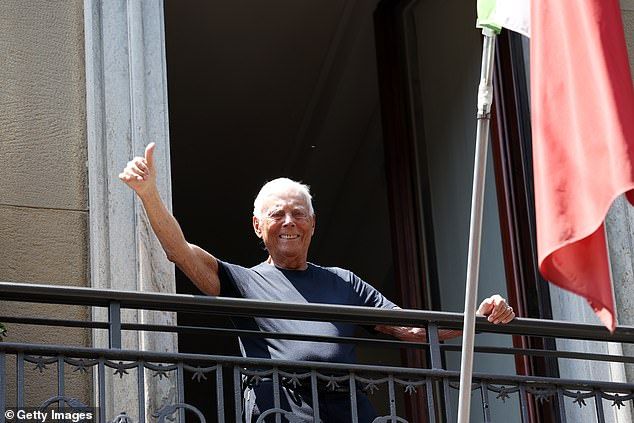 Armani puts his thumb up ahead of the Giorgio Armani fashion show in Milan Fashion Week on June 20, 2022