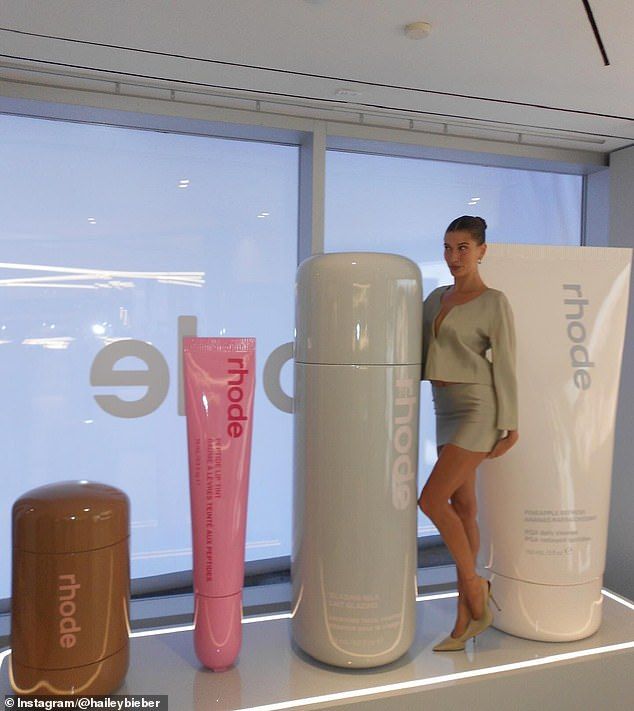 The star also shared this photo where she stood by her large Rhode bottles in NYC