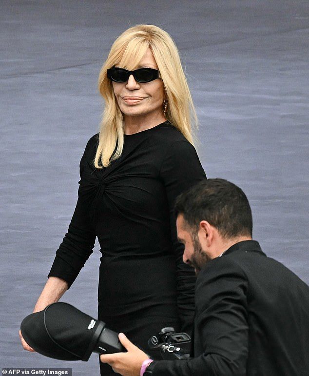 Donatella Versace, stepped down as head designer for Versace the earlier this year but is still its 'chief brand ambassador' (pictured at Paris Fashion Week, June)