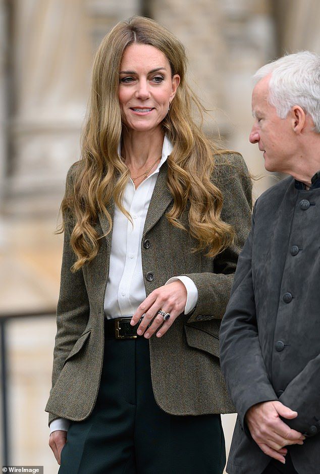 During yesterday's visit, Kate made a special tribute to her three children with her necklace, which included her children's initials of G for George, C for Charlotte, and L for Louis.