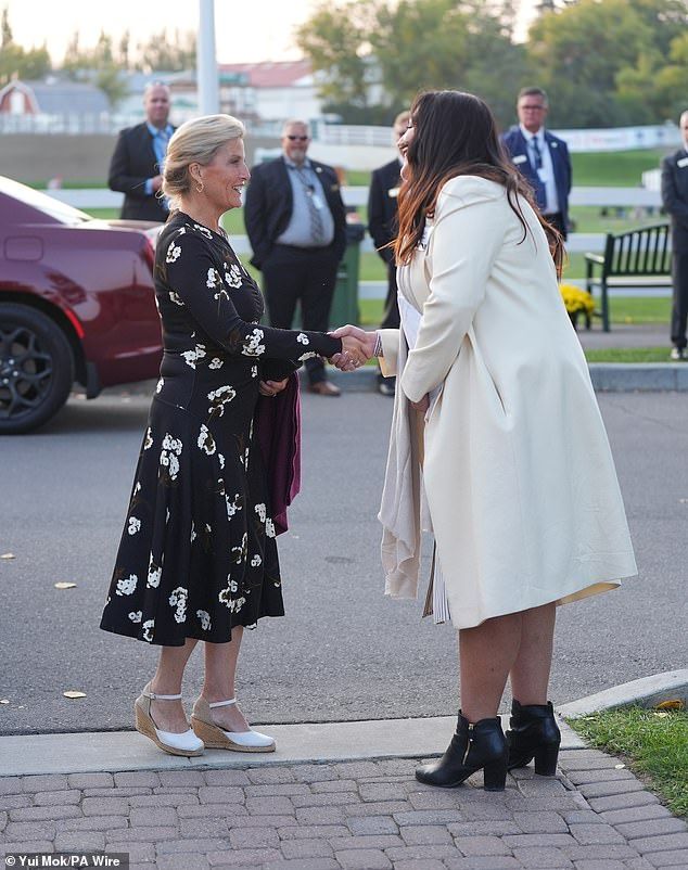 In the evening, she changed into florals for the Six Bar Challenge show jumping event, also at Spruce Meadows, of which she is patron