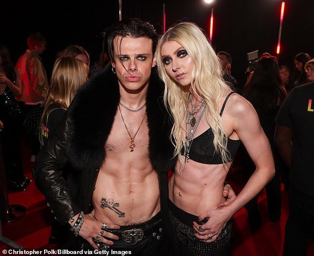 The singer-rhythm guitarist made sure to pose on the red carpet with fellow goth rocker, Yungblud, who similarly showcased his taut torso