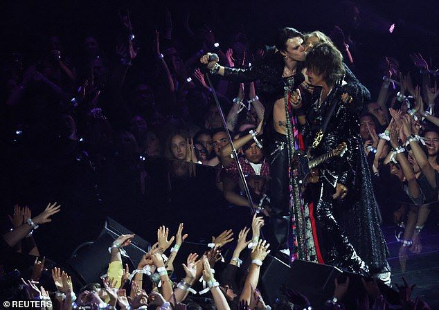 Yungblud appeared on stage with his best rendition of Ozzys 'All Aboard' call. He then went into Black Sabbaths Changes and Crazy Train before being joined by Tyler and Perry to perform Mama, Im Coming Home to wild applause