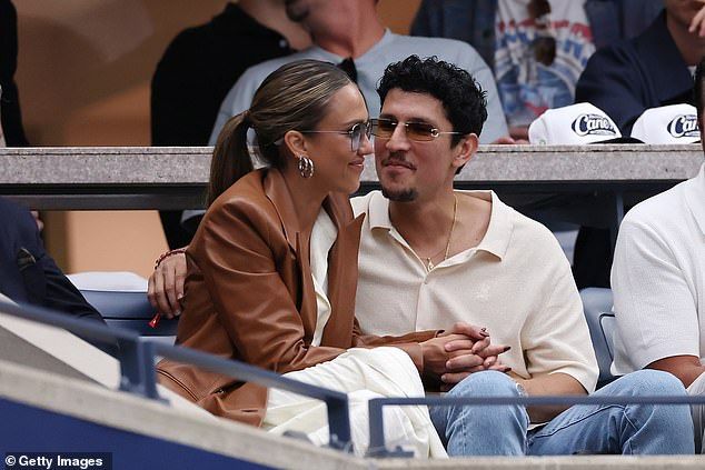 Jessica, 44, who split from husband Cash Warren earlier this year, could not keep her eyes off her new man, 32, as they appeared incredibly cosy while chatting in the stands