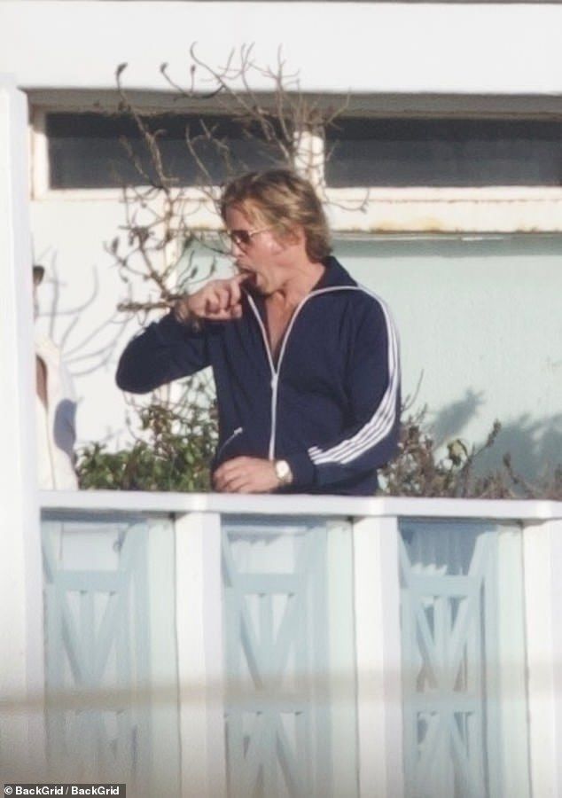 Brad Pitt appeared to be picking his teeth as he filmed the Once Upon A Time In Hollywood sequel, The Adventures of Cliff Booth, in Malibu on Sunday
