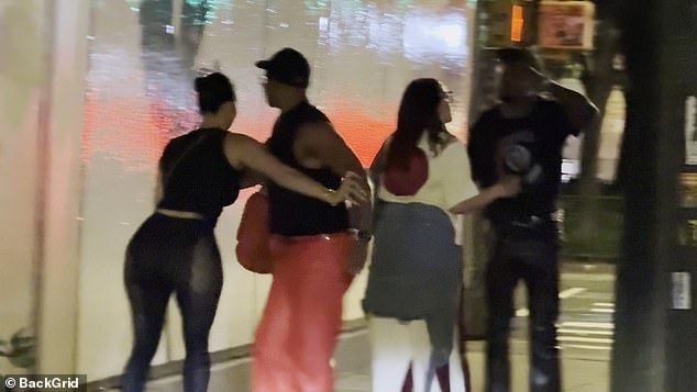The couple's friends hold them back and urge 'everybody forgive each other' amid the spat