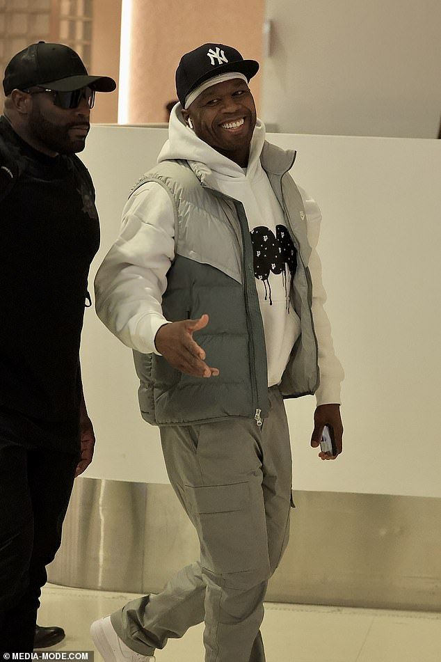 The In Da Club hitmaker, 50, cut a casual figure for his long-haul flight, stepping out in a light-grey sleeveless puffer jacket